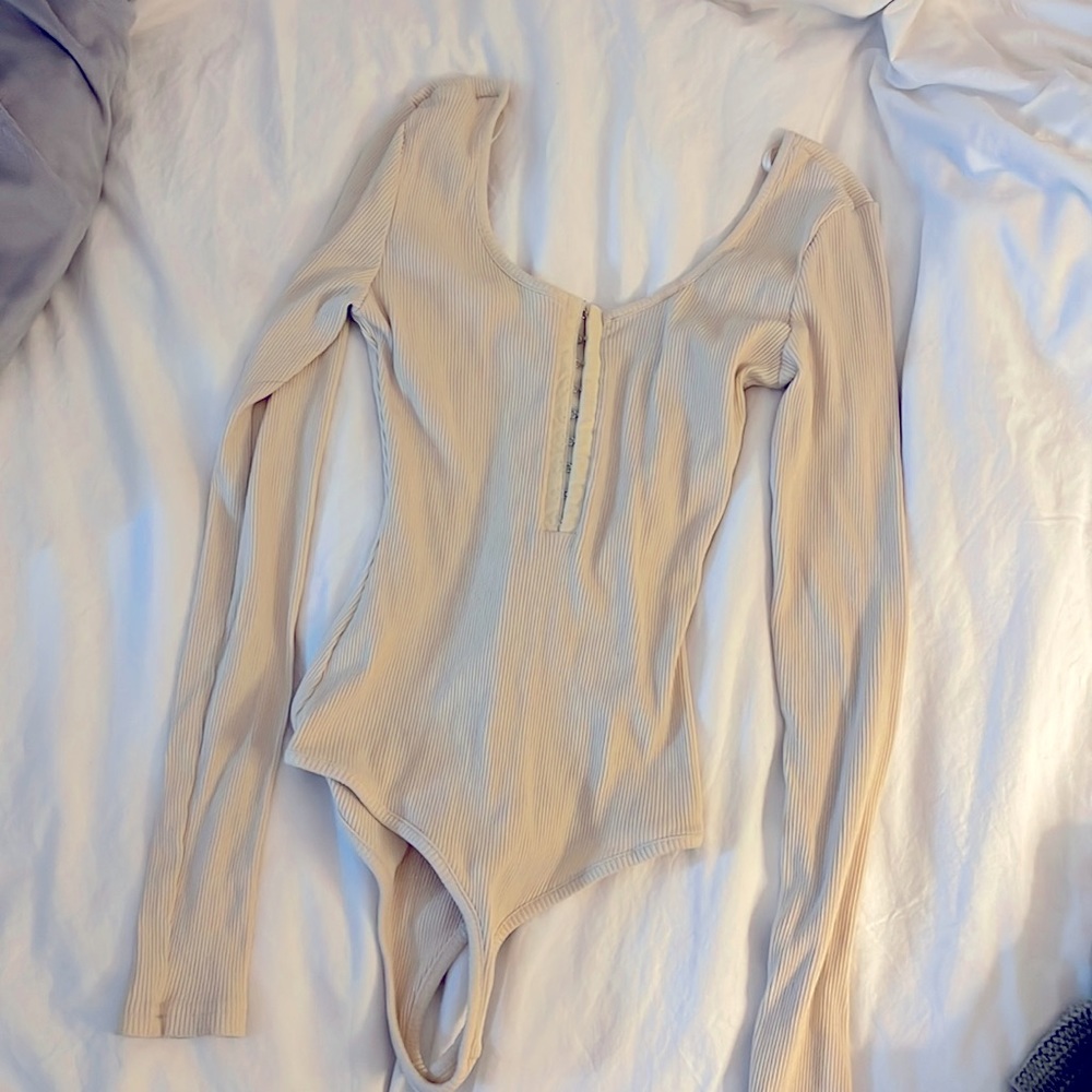 Cream colored one piece. Brand is Chelsea and Violet. Size small